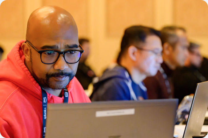 .conf24 attendee working on laptop