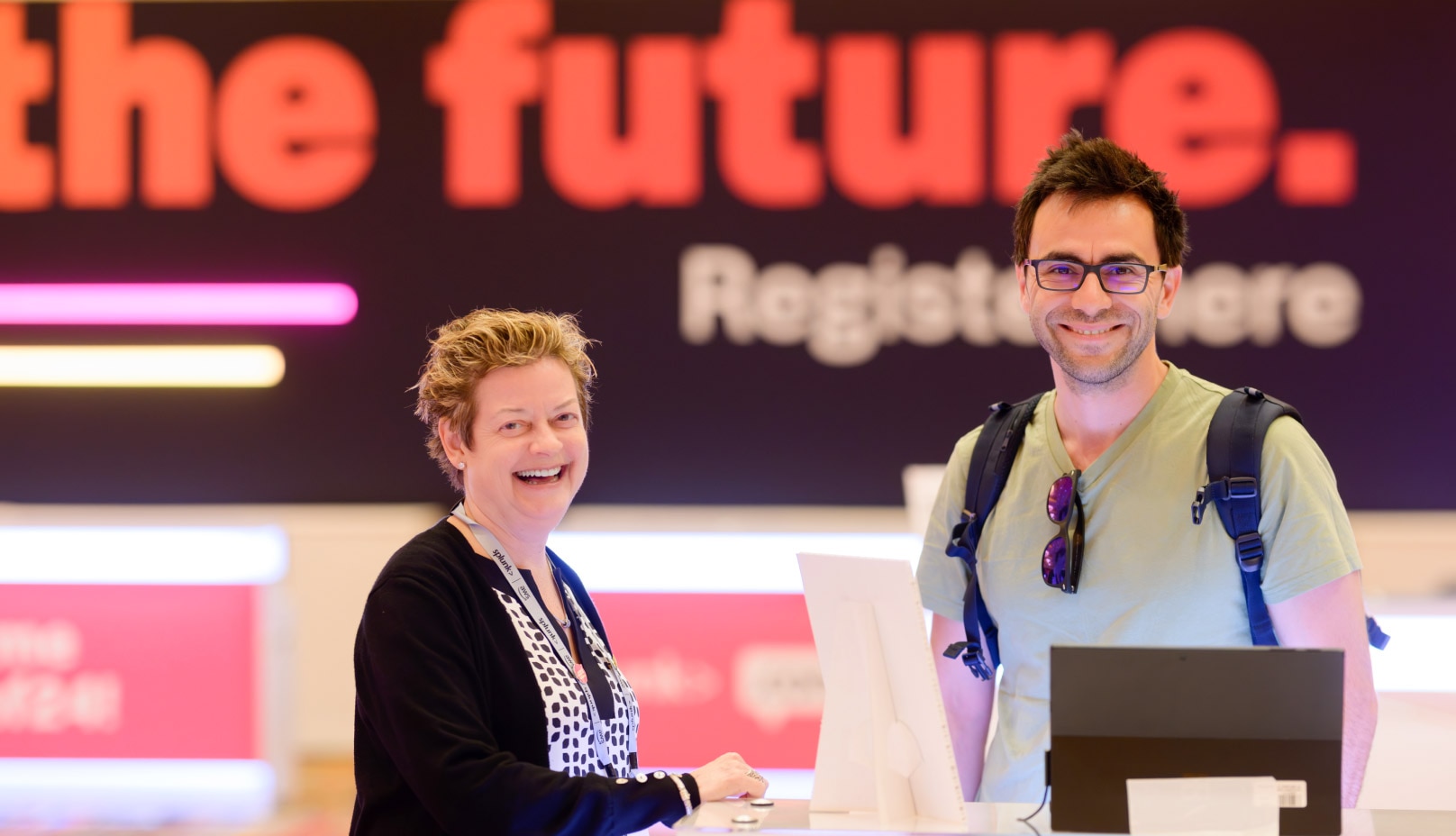 Man and woman posing at .conf registration